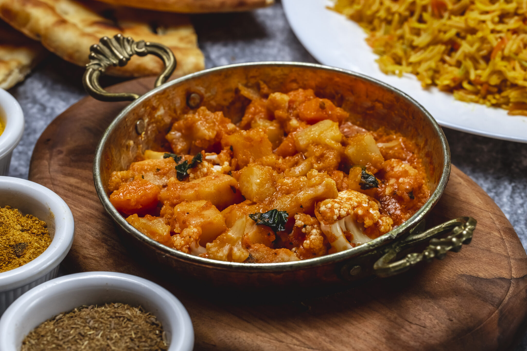 side view vegetable ragout with potato carrot and cauliflower and basil